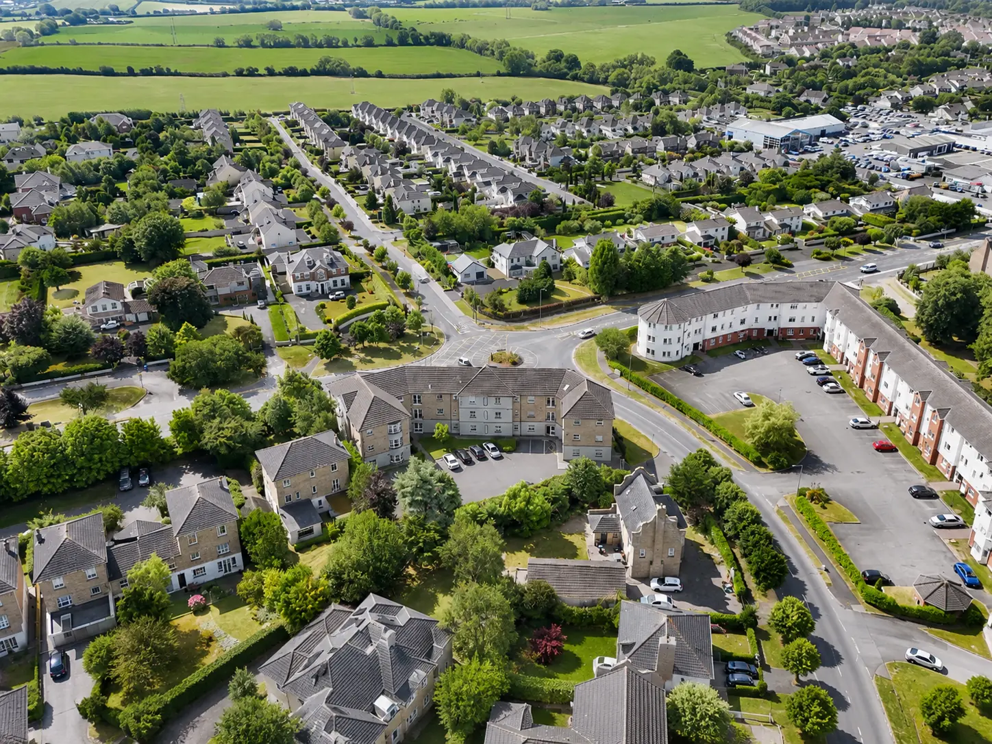 Aerial view of homes, gardens and surrounding green fields at Dunamase, Portlaoise
